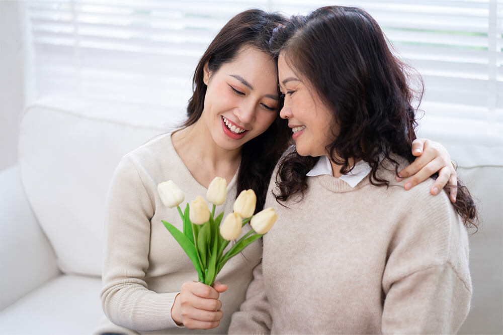 Mother and daughter celebrating their parent-child relationship with Valentine's Day Flowers