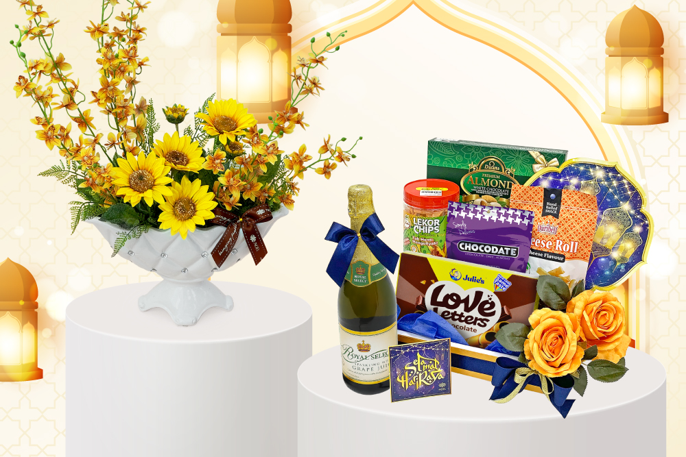 Hari Raya gift basket and floral arrangement featuring assorted chocolates, chips, cheese rolls, fresh yellow gerberas and bright artificial flowers.